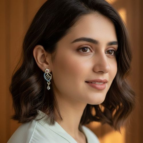 166gold-plated fashion earrings featuring a leaf design with blue and pink stone embellishments and a floral stud top,