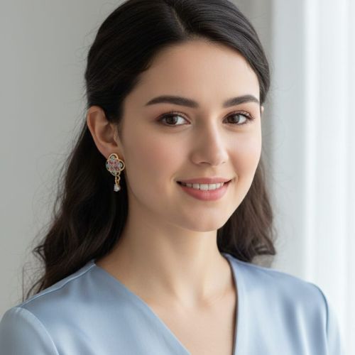 196gold-toned fashion earrings featuring a floral or clover-like design with pink and blue stones