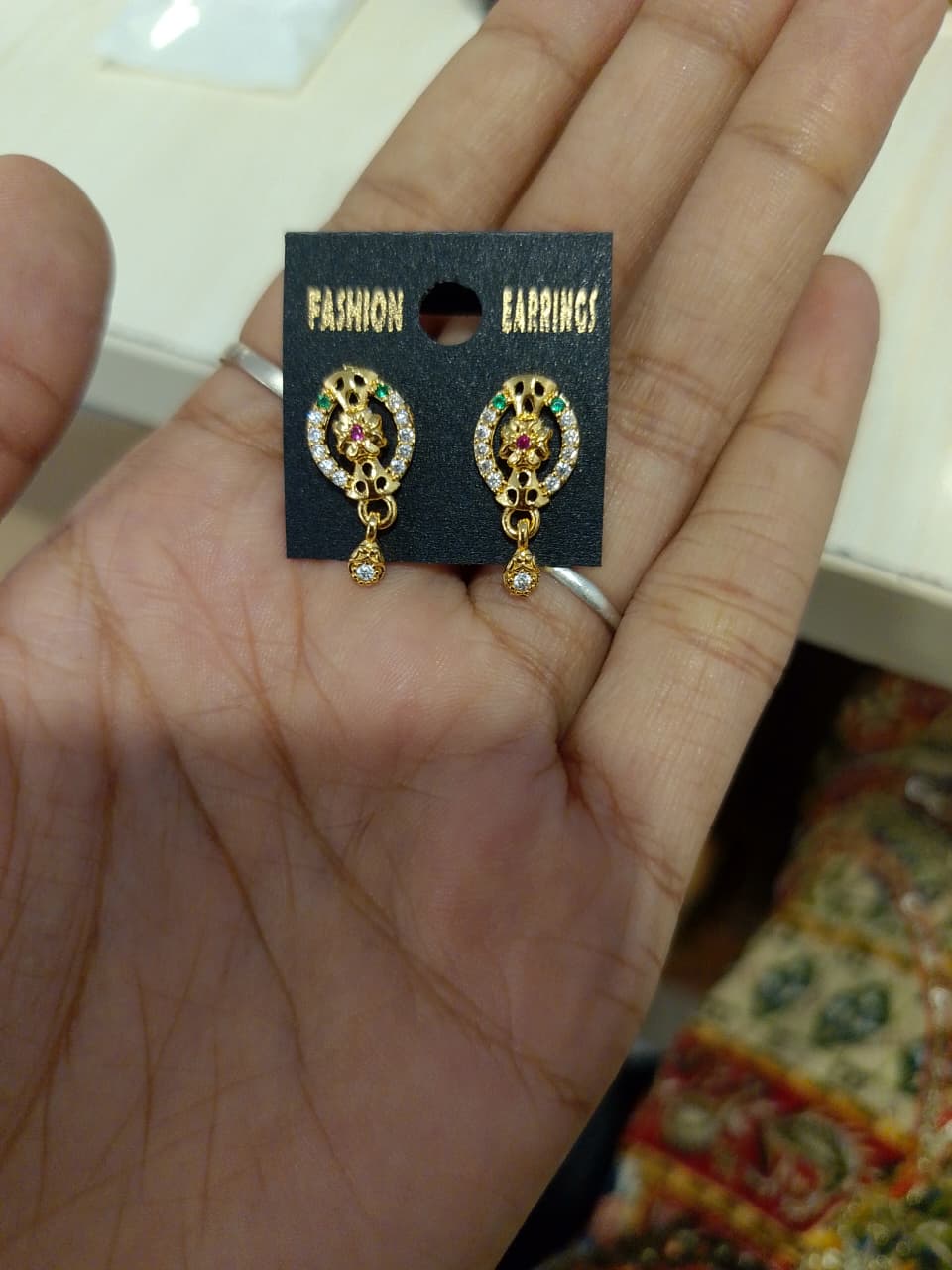 gold-plated stud earrings with a dangling drop, adorned with cubic zirconia (AD stones). - Image 3