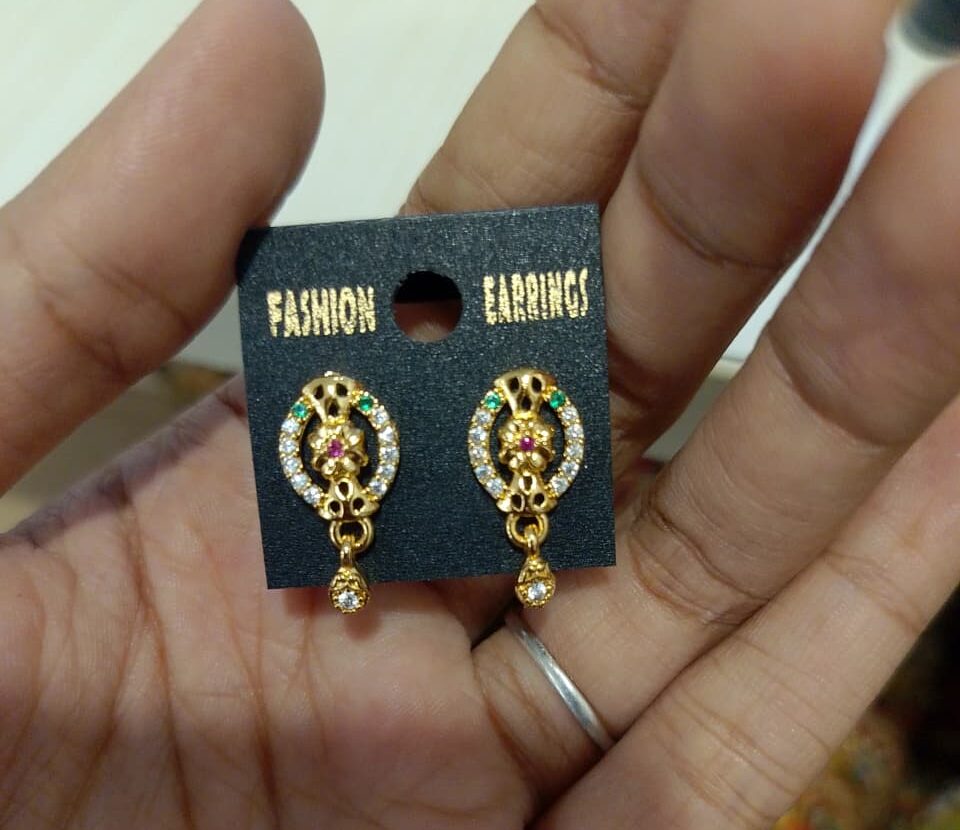 gold-plated stud earrings with a dangling drop, adorned with cubic zirconia (AD stones).