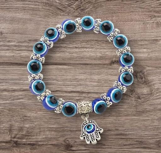 Evil Eye bracelet with a Hamsa Hand charm.
