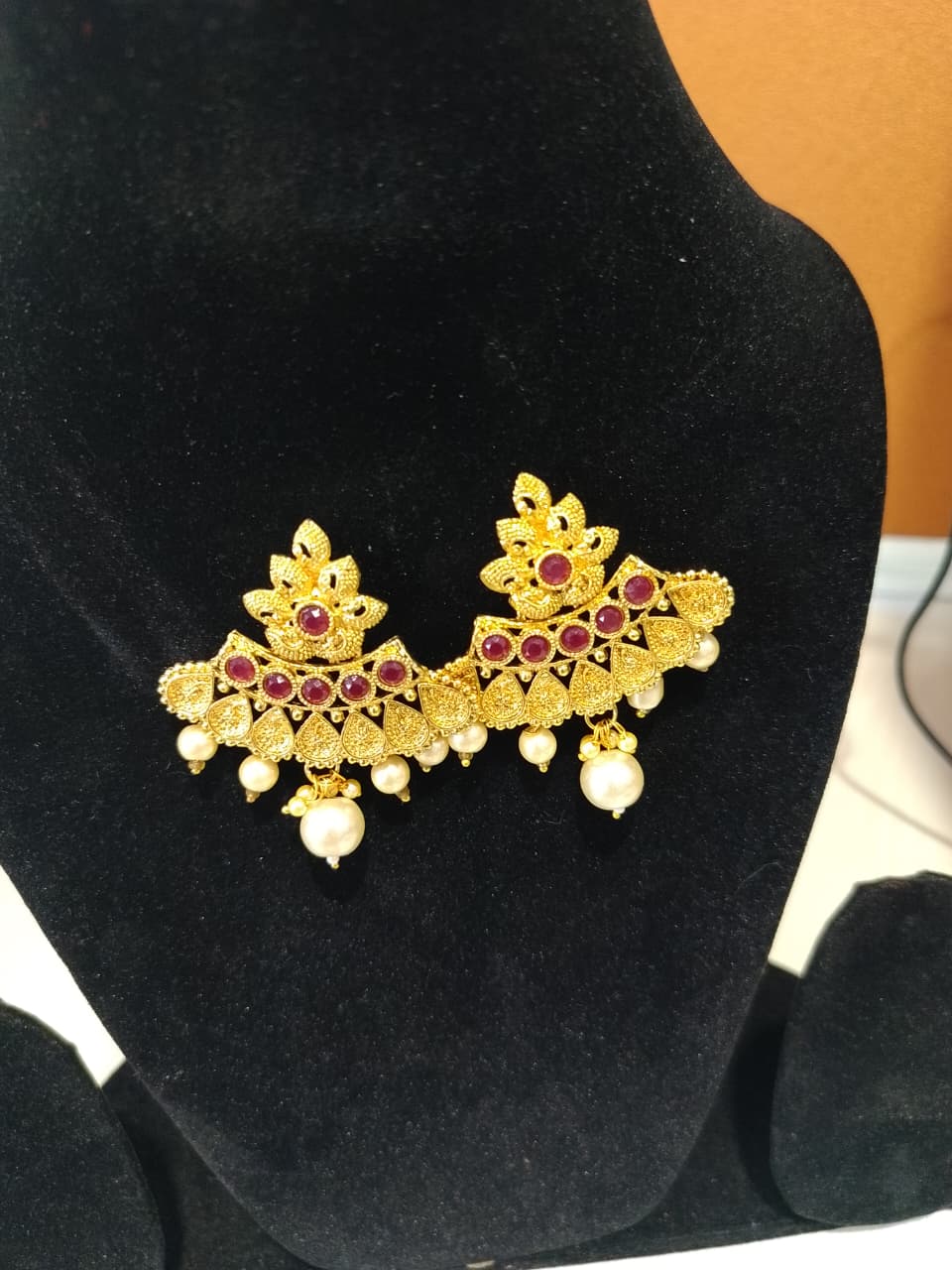 This is a pair of traditional Indian earrings, often referred to as jhumkas or chandbalis - Image 4