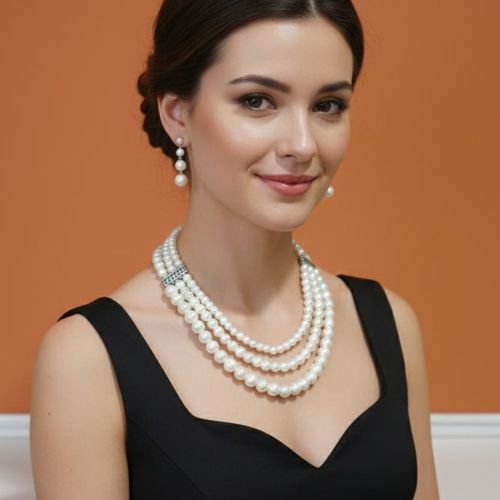 526 three-strand (or three-layer) white pearl necklace set with matching drop earrings