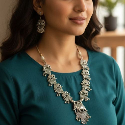 546 temple matte gold-plated elephant necklace set with matching earrings.